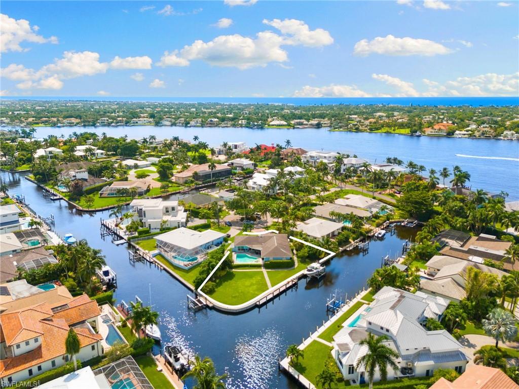 2140 Shad Court Naples, FL 34102 - Photo 2 of 44 an aerial view of residential houses with outdoor space and river