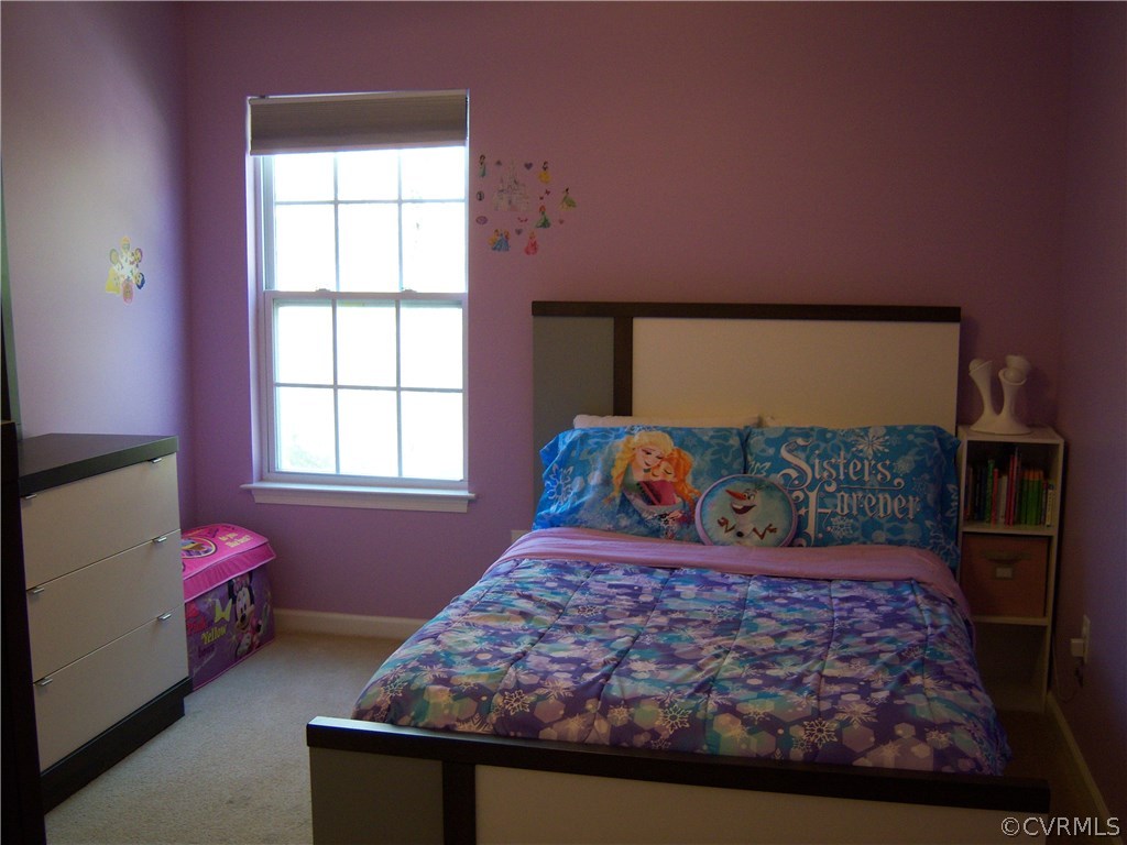 2115 Pemberton Road Henrico, VA 23238 - Photo 15 of 33 a bed sitting in a bedroom next to a window