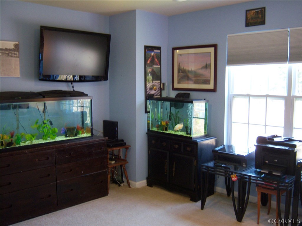 2115 Pemberton Road Henrico, VA 23238 - Photo 21 of 33 a view of a workspace with furniture and a window