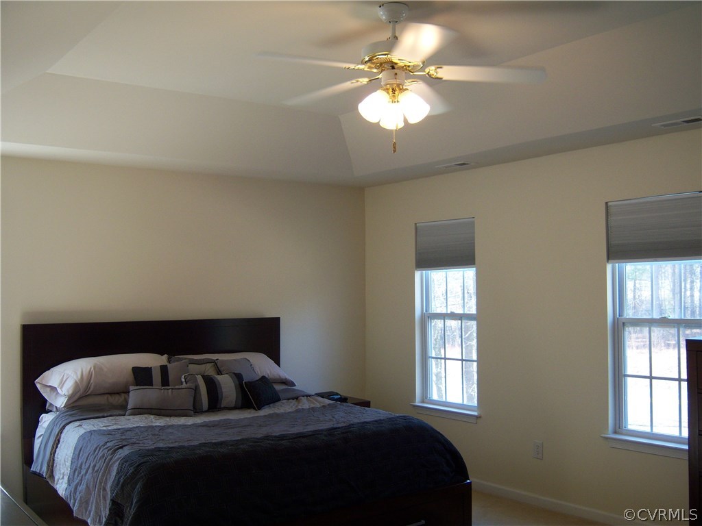 2115 Pemberton Road Henrico, VA 23238 - Photo 24 of 33 a bedroom with a bed window and a chandelier