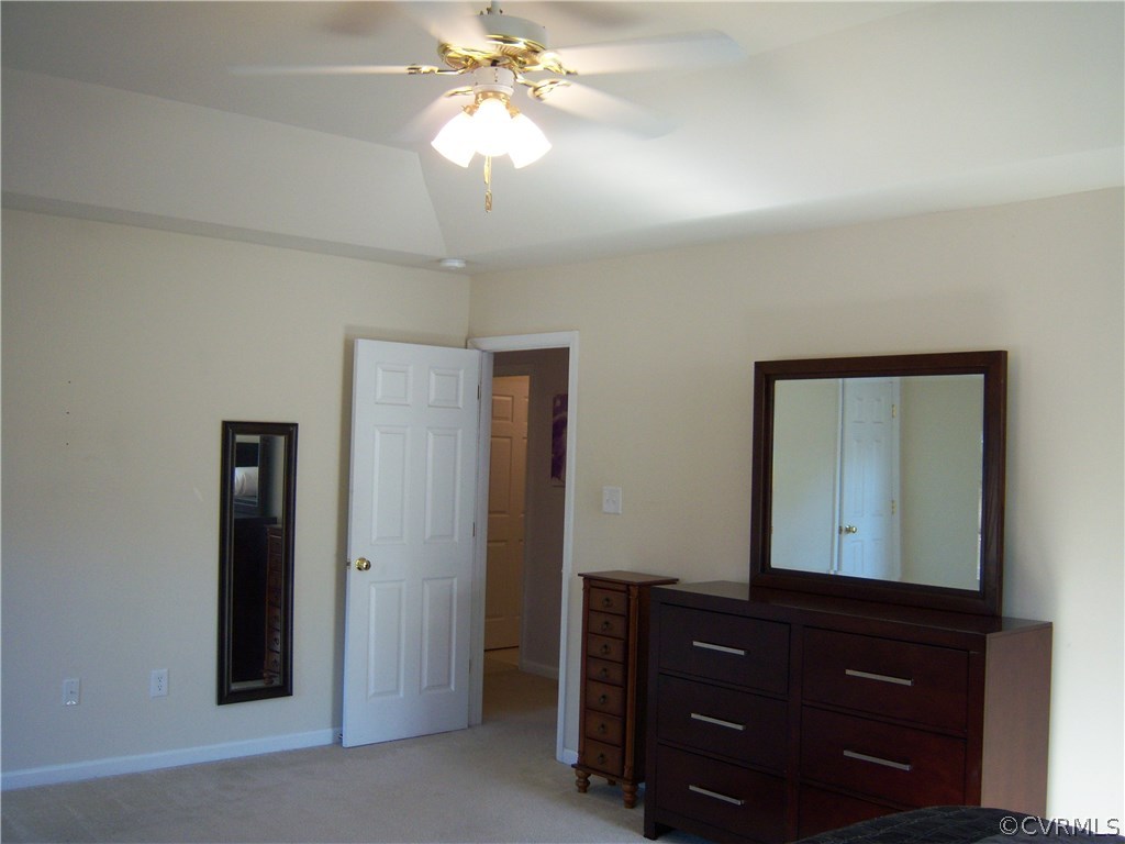 2115 Pemberton Road Henrico, VA 23238 - Photo 25 of 33 a view of a hallway with a dresser and chandelier
