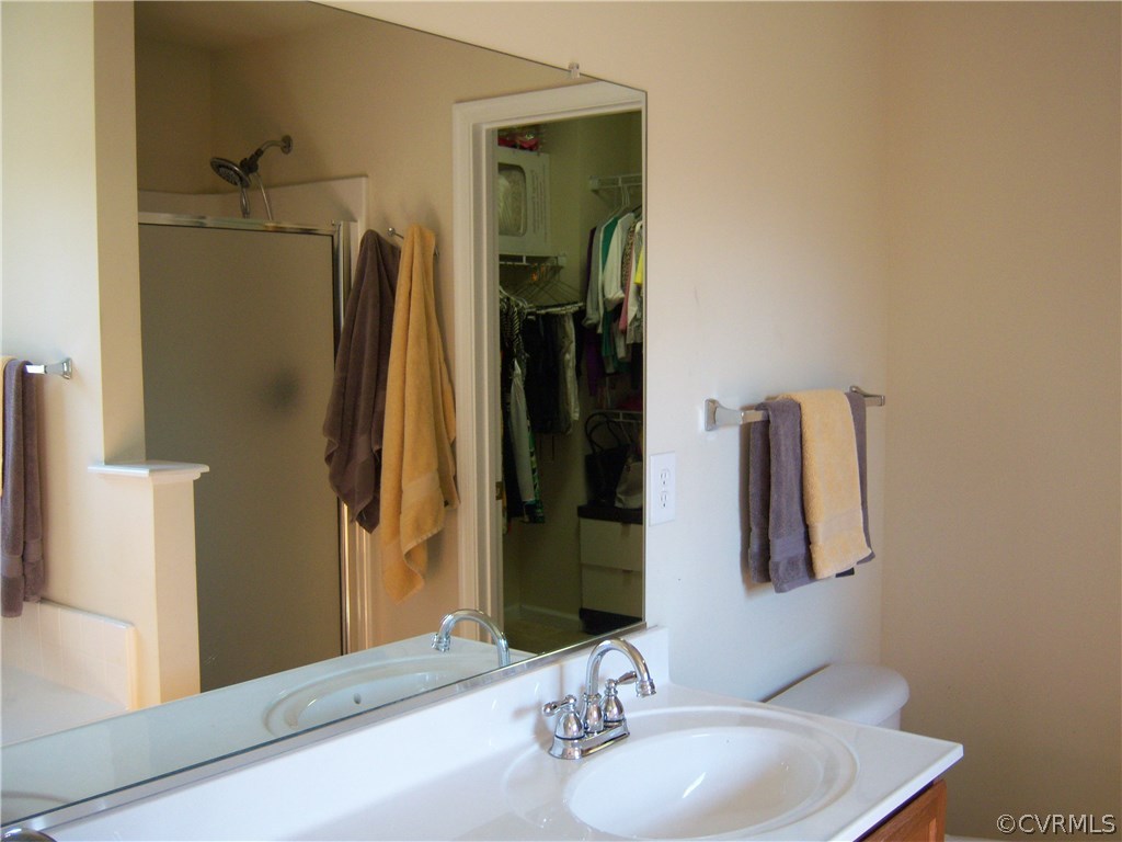 2115 Pemberton Road Henrico, VA 23238 - Photo 28 of 33 a bathroom with a sink vanity and a mirror