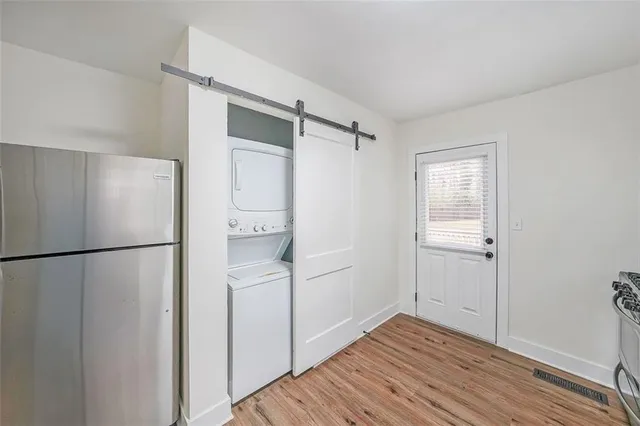 a view of kitchen with a refrigerator