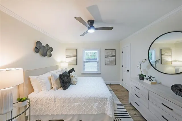 a bedroom with a bed and a mirror