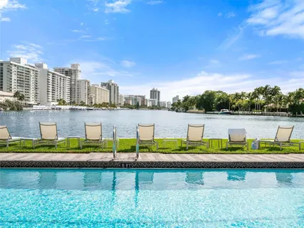 a view of lake with a city