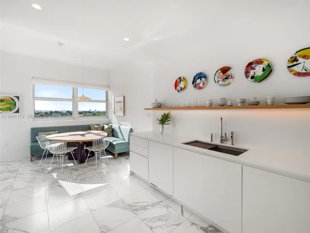 a dining room with a table and chairs