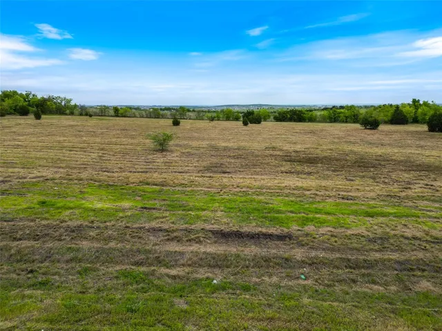 a view of an ocean beach and city