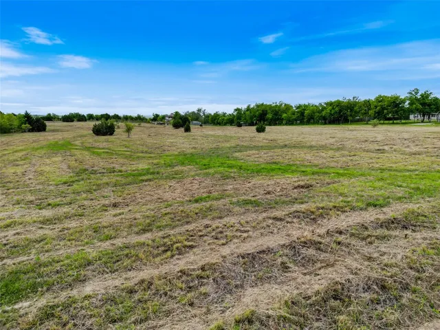 a view of a lake with houses in the back