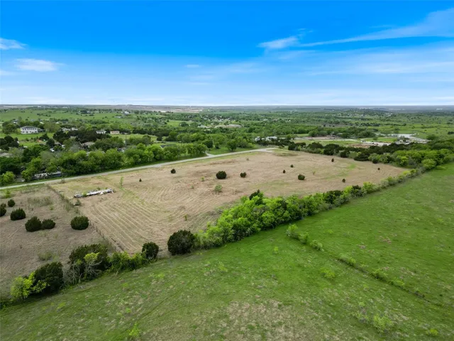 a view of an outdoor space with seating area and barbeque oven