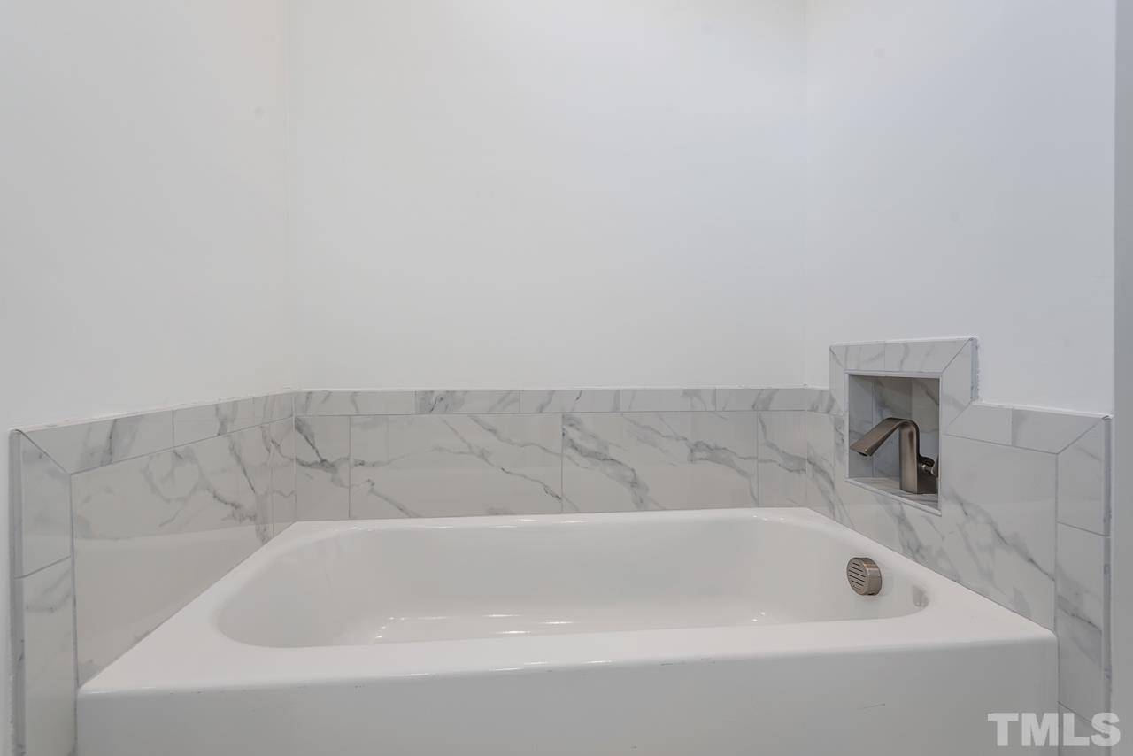 1115 Nova Street Durham, NC 27713 - Photo 43 of 56 a bathroom with a bathtub