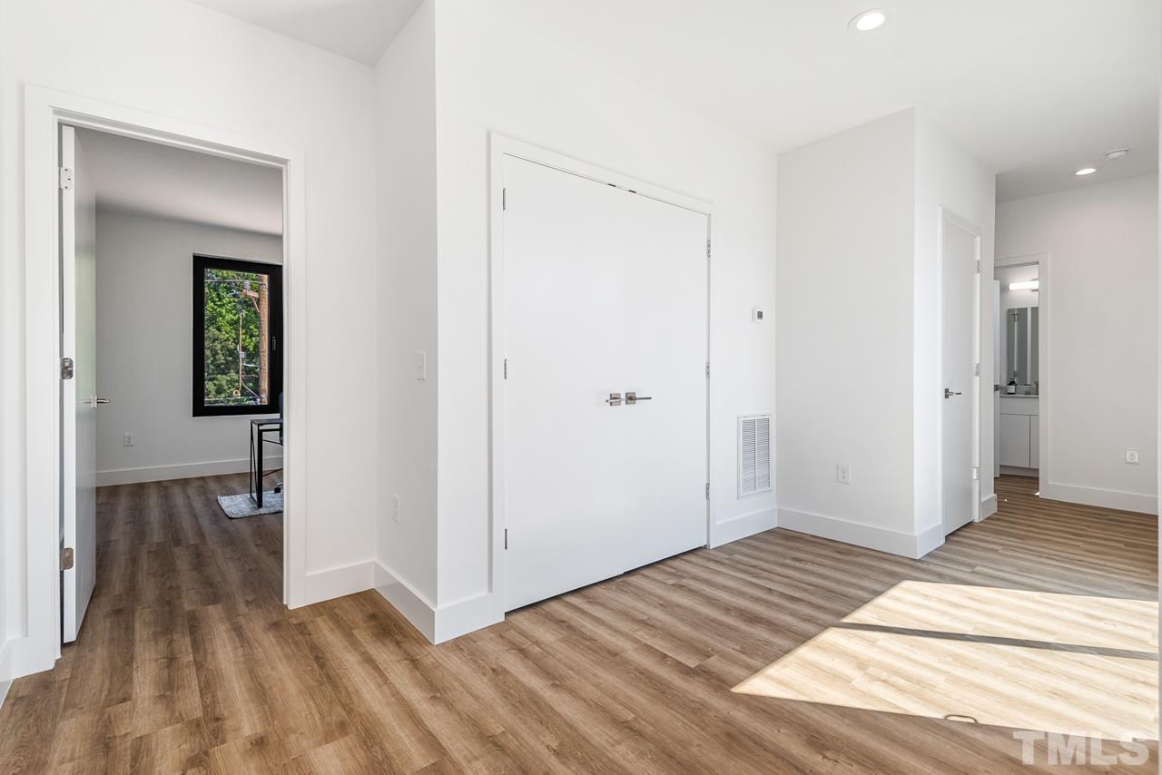 1115 Nova Street Durham, NC 27713 - Photo 45 of 56 a view of a room with wooden floor and a bathroom