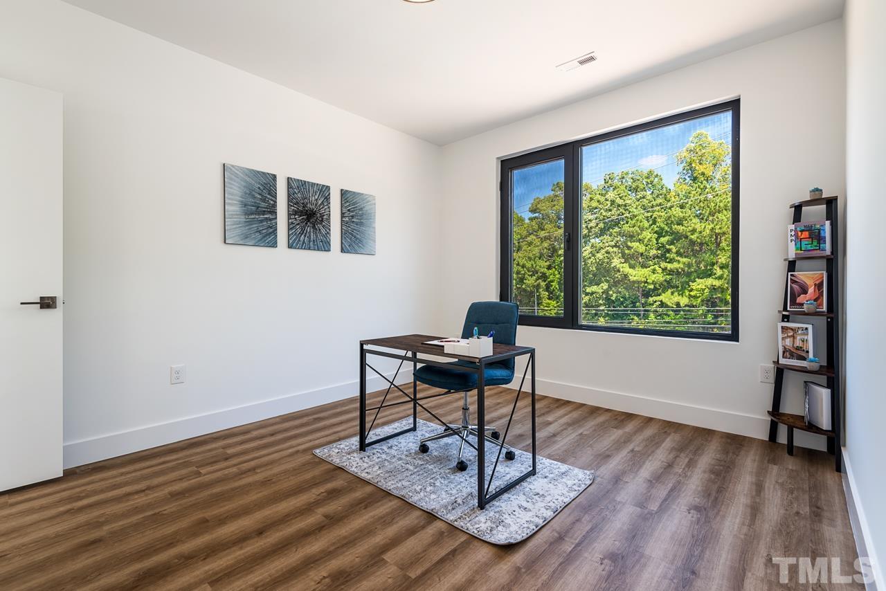 1115 Nova Street Durham, NC 27713 - Photo 48 of 56 a work room with furniture and a window