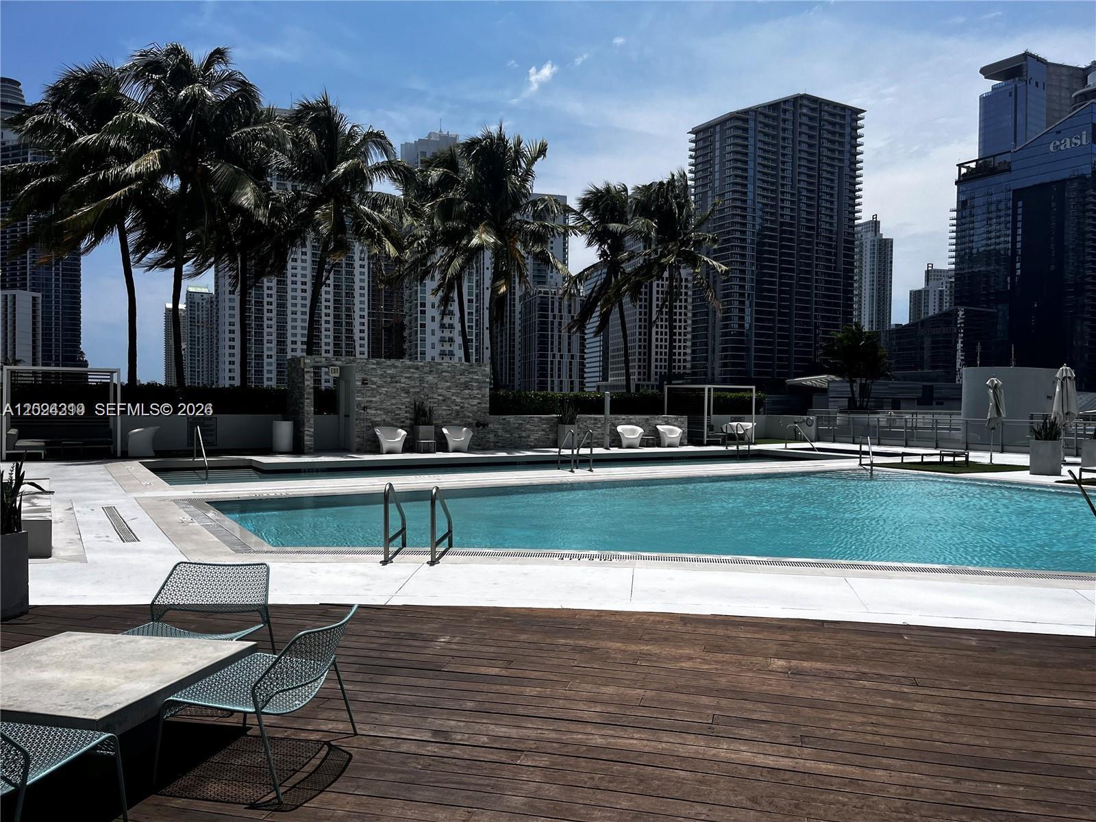 90 Southwest 3rd Street, Unit 1409 Miami, FL 33130 - Photo 25 of 25 a view of swimming pool with outdoor seating and yard