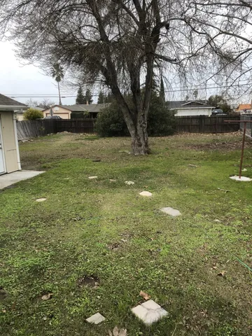 a backyard of a house with lots of green space