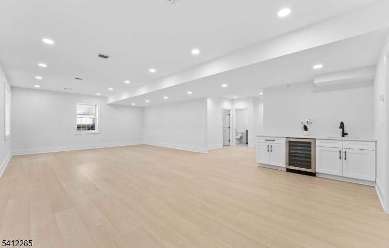 13 Penwood Road Livingston, NJ 07039 - Photo 14 of 18 a view of an empty room with a kitchen
