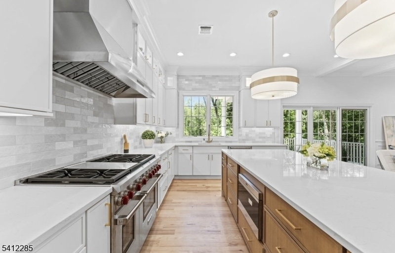 13 Penwood Road Livingston, NJ 07039 - Photo 5 of 18 a kitchen with a sink stove and cabinets