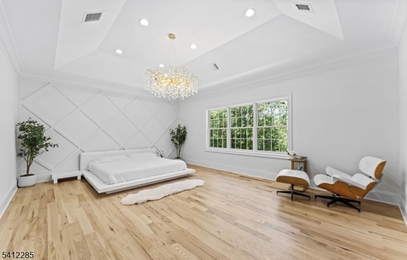 13 Penwood Road Livingston, NJ 07039 - Photo 7 of 18 a living room with furniture and a chandelier