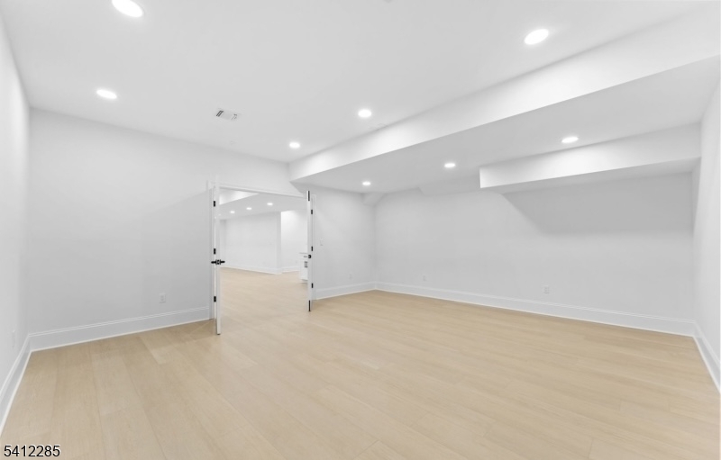 13 Penwood Road Livingston, NJ 07039 - Photo 8 of 18 an empty room with a kitchen
