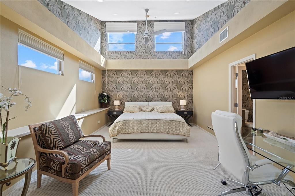 2254 Harbour Ct Drive Longboat Key, FL 34228 - Photo 12 of 57 a living room with furniture and a flat screen tv