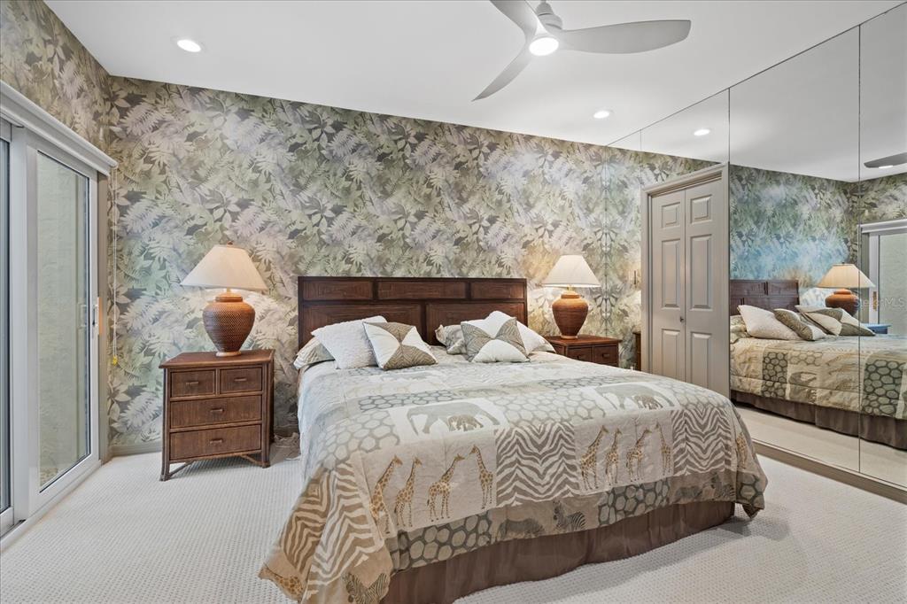 2254 Harbour Ct Drive Longboat Key, FL 34228 - Photo 18 of 57 a bedroom with a bed and window