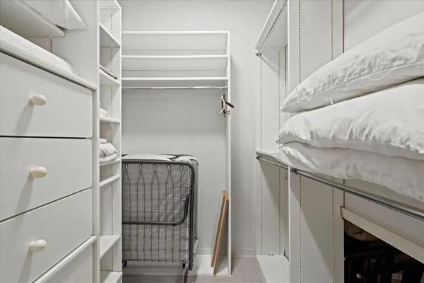 a view of a livingroom with workspace and a couch