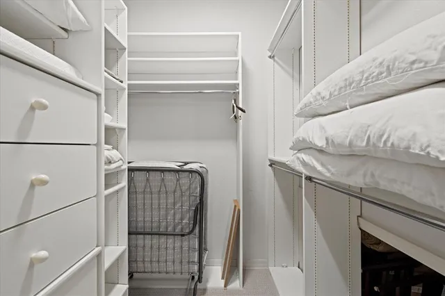 a view of a livingroom with workspace and a couch