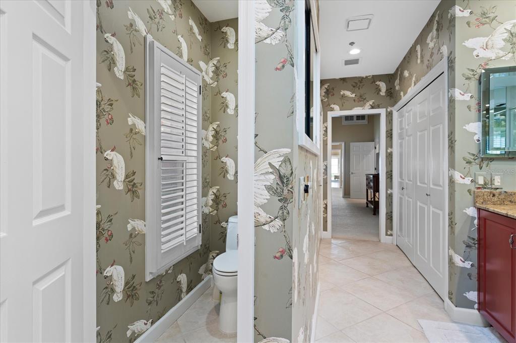 2254 Harbour Ct Drive Longboat Key, FL 34228 - Photo 25 of 57 a bathroom with a shower and a toilet