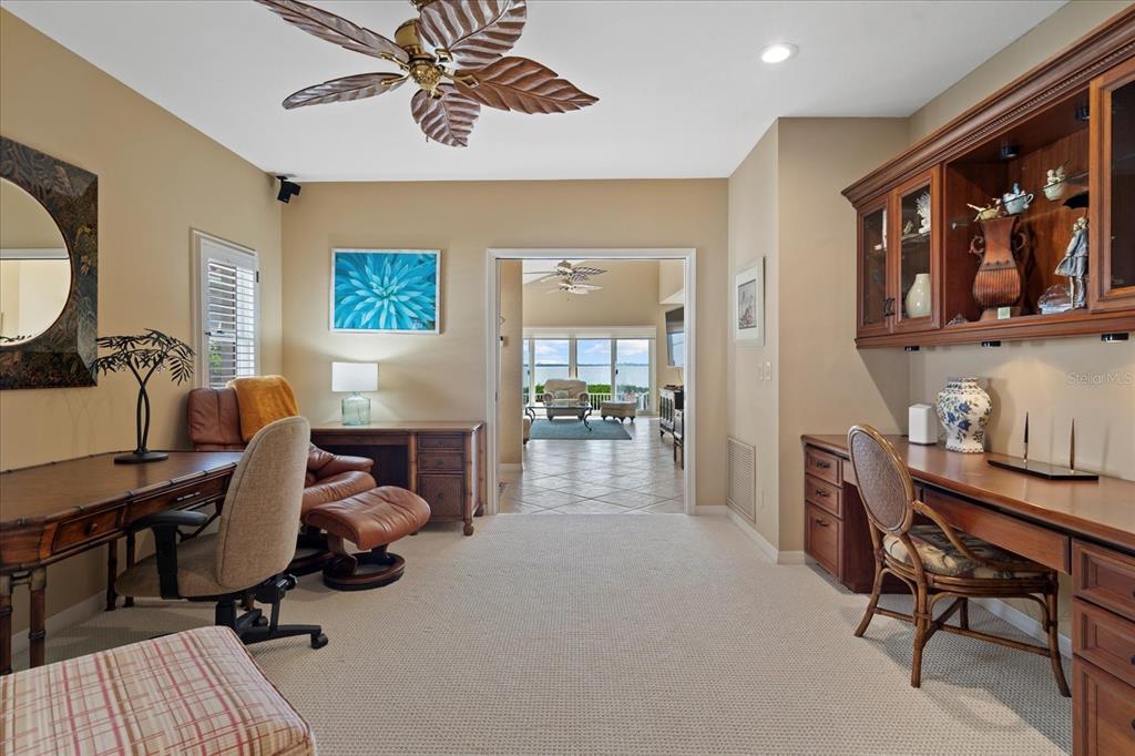 2254 Harbour Ct Drive Longboat Key, FL 34228 - Photo 26 of 57 a view of a livingroom with workspace and a couch