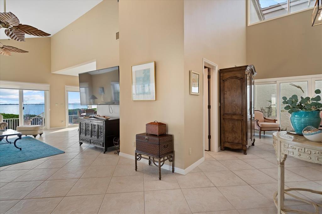 2254 Harbour Ct Drive Longboat Key, FL 34228 - Photo 28 of 57 a living room with furniture and a dining table