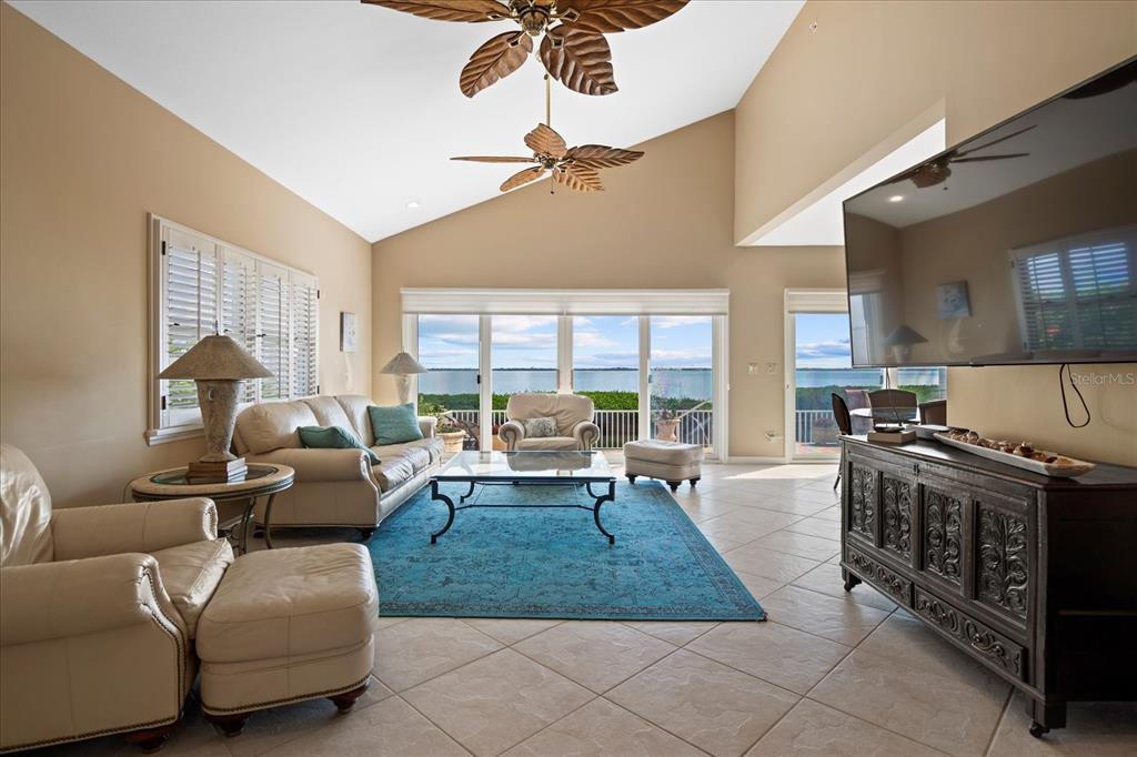 2254 Harbour Ct Drive Longboat Key, FL 34228 - Photo 29 of 57 a living room with furniture and a fireplace