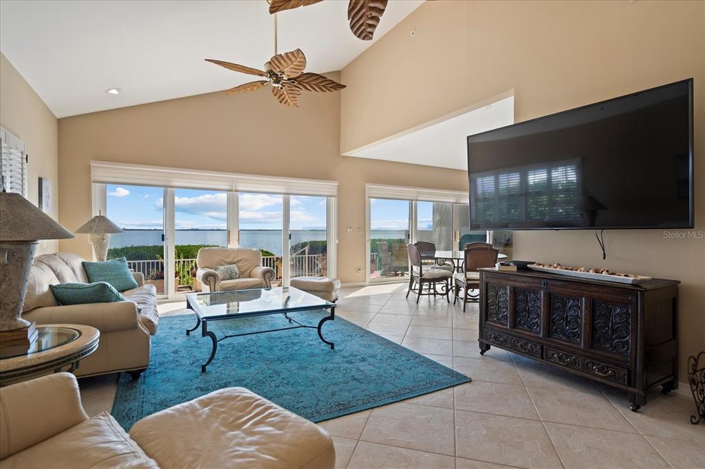 2254 Harbour Ct Drive Longboat Key, FL 34228 - Photo 30 of 57 a living room with furniture and a flat screen tv