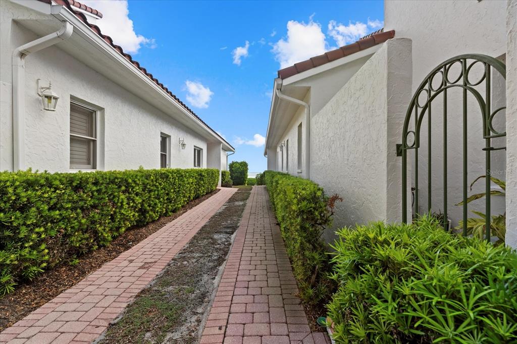 2254 Harbour Ct Drive Longboat Key, FL 34228 - Photo 3 of 57 a view of a pathway in outside of the house