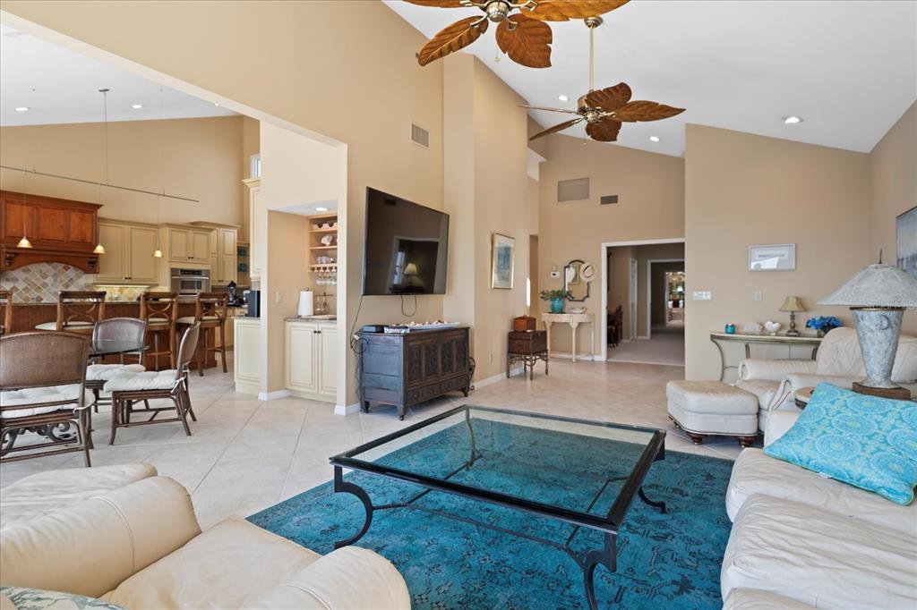 2254 Harbour Ct Drive Longboat Key, FL 34228 - Photo 31 of 57 a living room with furniture and a flat screen tv