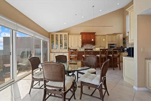 a kitchen with granite countertop a sink stove and cabinets