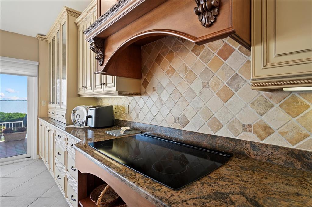 2254 Harbour Ct Drive Longboat Key, FL 34228 - Photo 38 of 57 a kitchen with a sink and a stove next to a window