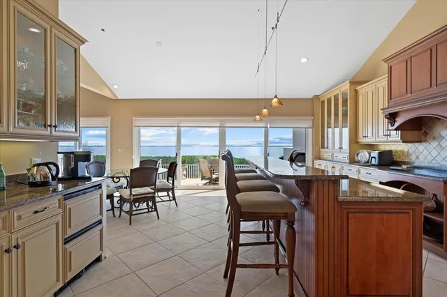 a bedroom with a large bed and a shower