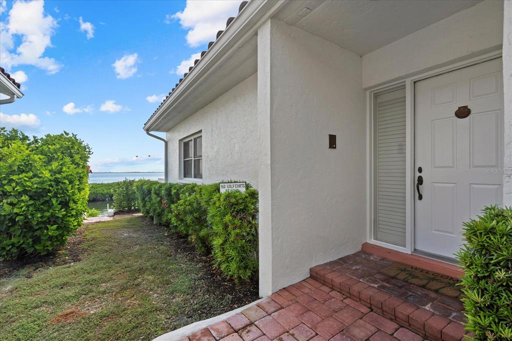 2254 Harbour Ct Drive Longboat Key, FL 34228 - Photo 4 of 57 a view of a house with a yard