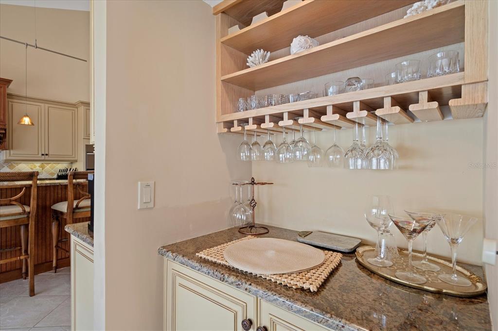 2254 Harbour Ct Drive Longboat Key, FL 34228 - Photo 41 of 57 a bathroom with a granite countertop sink a mirror and vanity