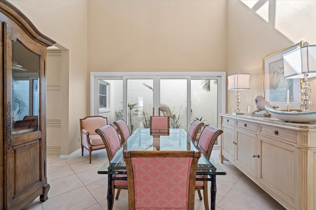 2254 Harbour Ct Drive Longboat Key, FL 34228 - Photo 43 of 57 a view of a dining room with furniture window and outside view