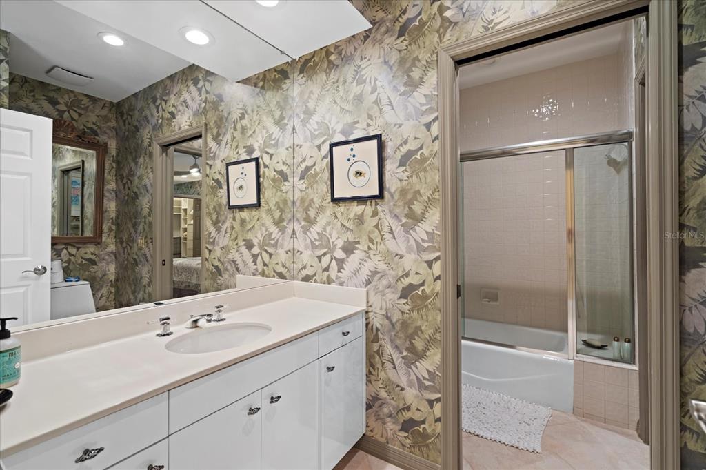 2254 Harbour Ct Drive Longboat Key, FL 34228 - Photo 46 of 57 a bathroom with a sink and a mirror