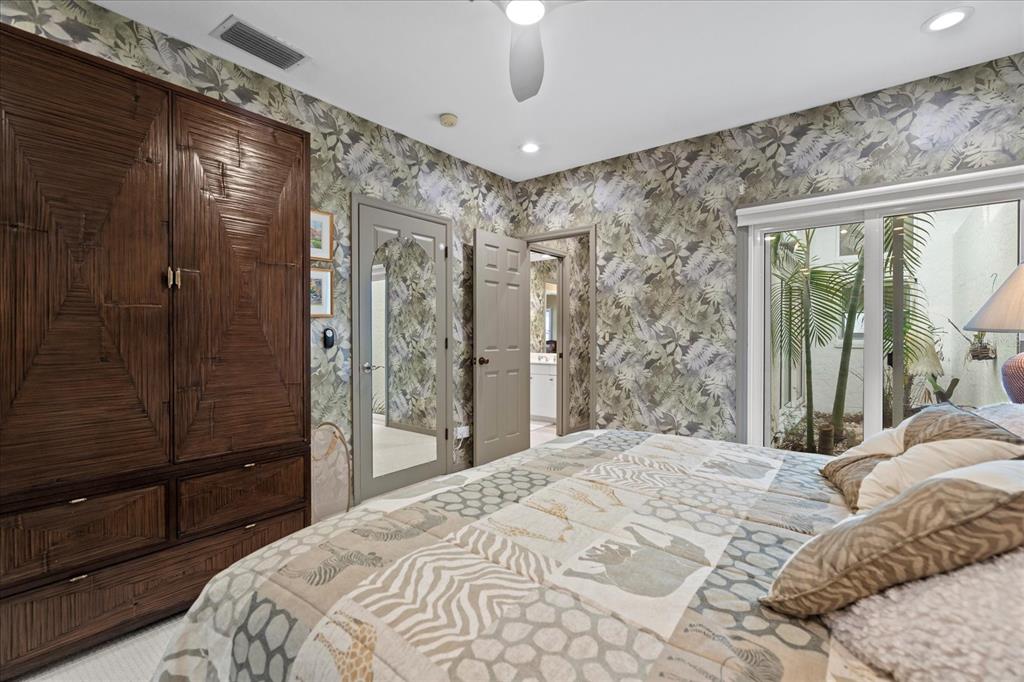 2254 Harbour Ct Drive Longboat Key, FL 34228 - Photo 47 of 57 a bedroom with a large bed and a shower