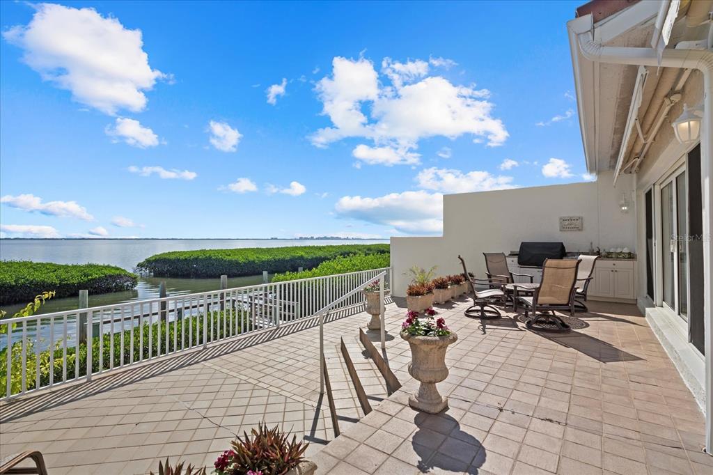 2254 Harbour Ct Drive Longboat Key, FL 34228 - Photo 52 of 57 a view of a terrace with furniture