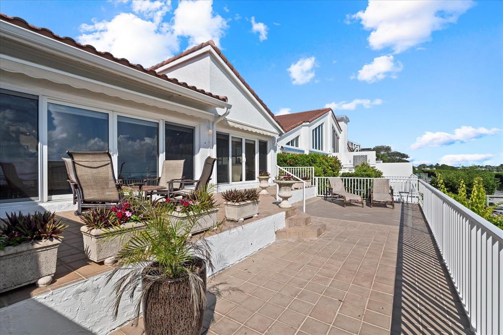 2254 Harbour Ct Drive Longboat Key, FL 34228 - Photo 54 of 57 a view of a house with patio outdoor seating