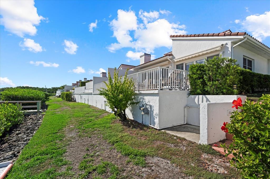 2254 Harbour Ct Drive Longboat Key, FL 34228 - Photo 56 of 57 a view of a house with a yard and plants