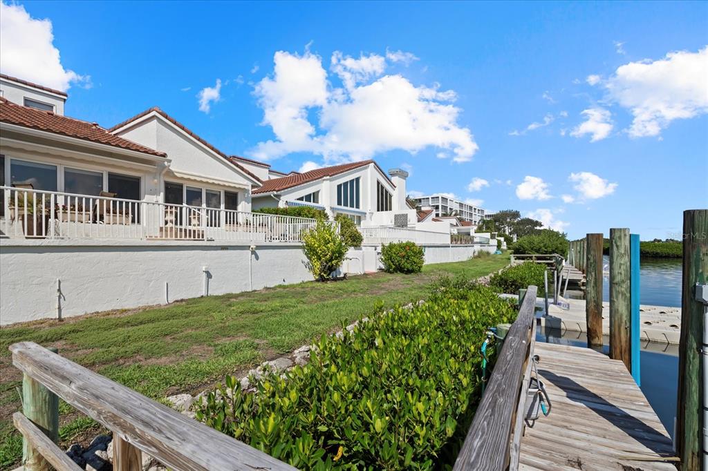 2254 Harbour Ct Drive Longboat Key, FL 34228 - Photo 57 of 57 a front view of a house with a yard