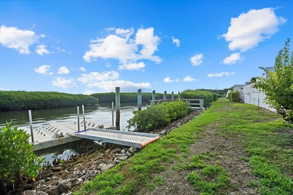 a view of a house with wooden deck