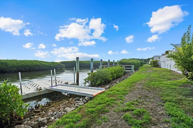 a view of a house with wooden deck
