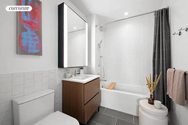 a bathroom with a toilet a sink and bathtub