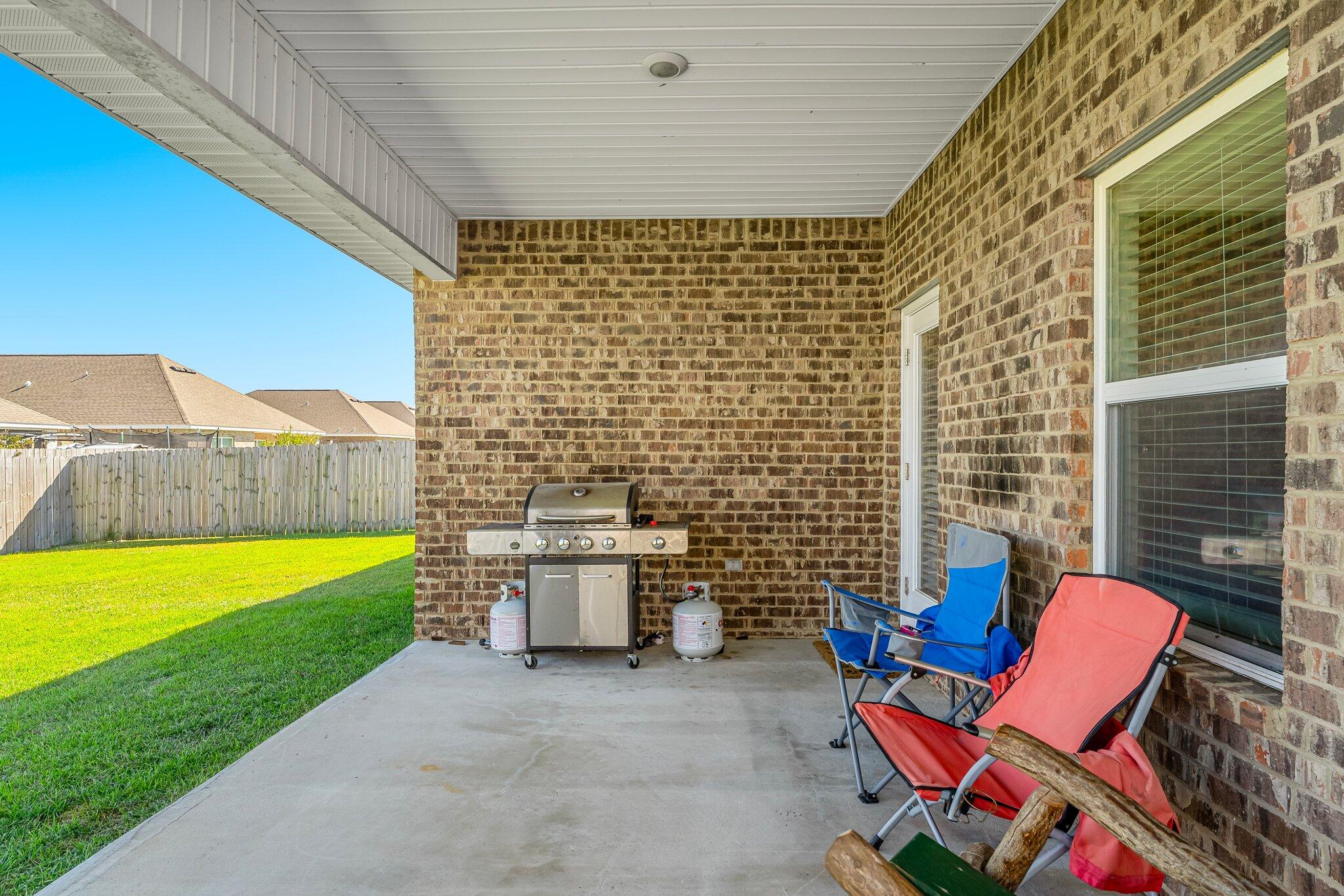 813 Cason Circle Panama City, FL 32405 - Photo 16 of 20 a backyard of a house with outdoor seating