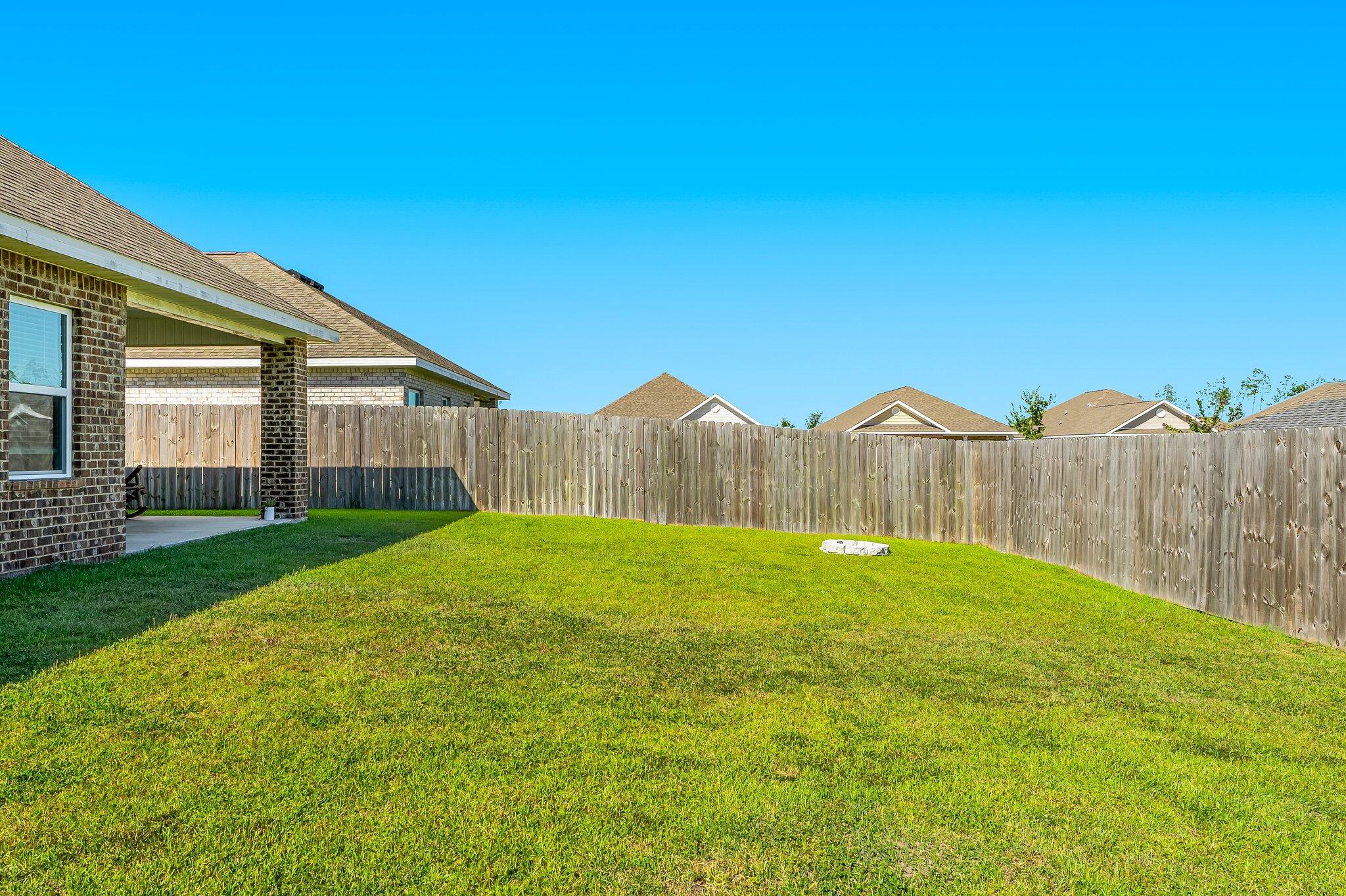 813 Cason Circle Panama City, FL 32405 - Photo 19 of 20 a view of a house with backyard and a garden